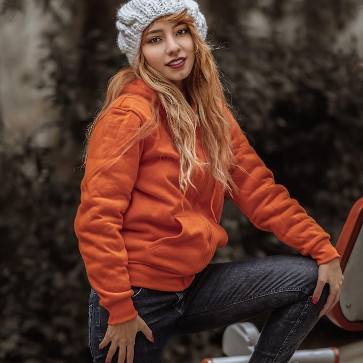 Ava Sharma, Lead Design Curator at ClaspRivetCog, reviewing corporate floral arrangements